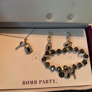 Matching lock necklace earrings and bracelet.